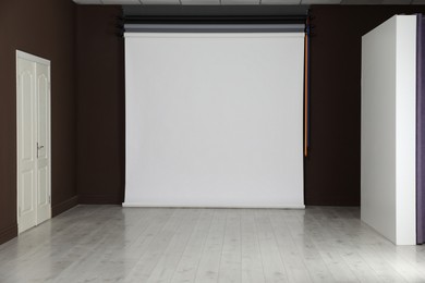 Photo of Empty white photo background. Professional studio equipment