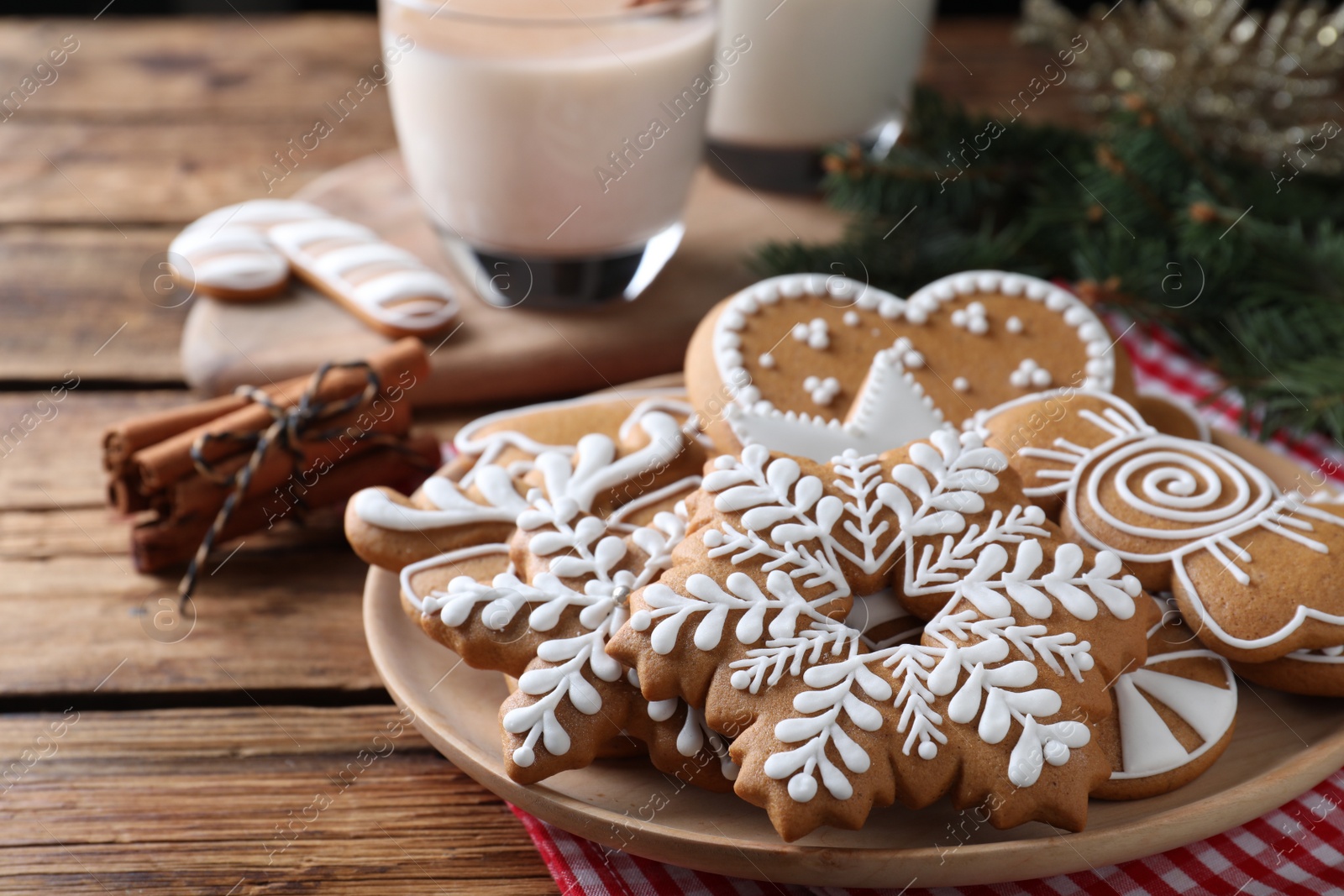 Photo of Delicious gingerbread Christmas cookies on wooden table, closeup