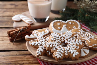 Delicious gingerbread Christmas cookies on wooden table, closeup