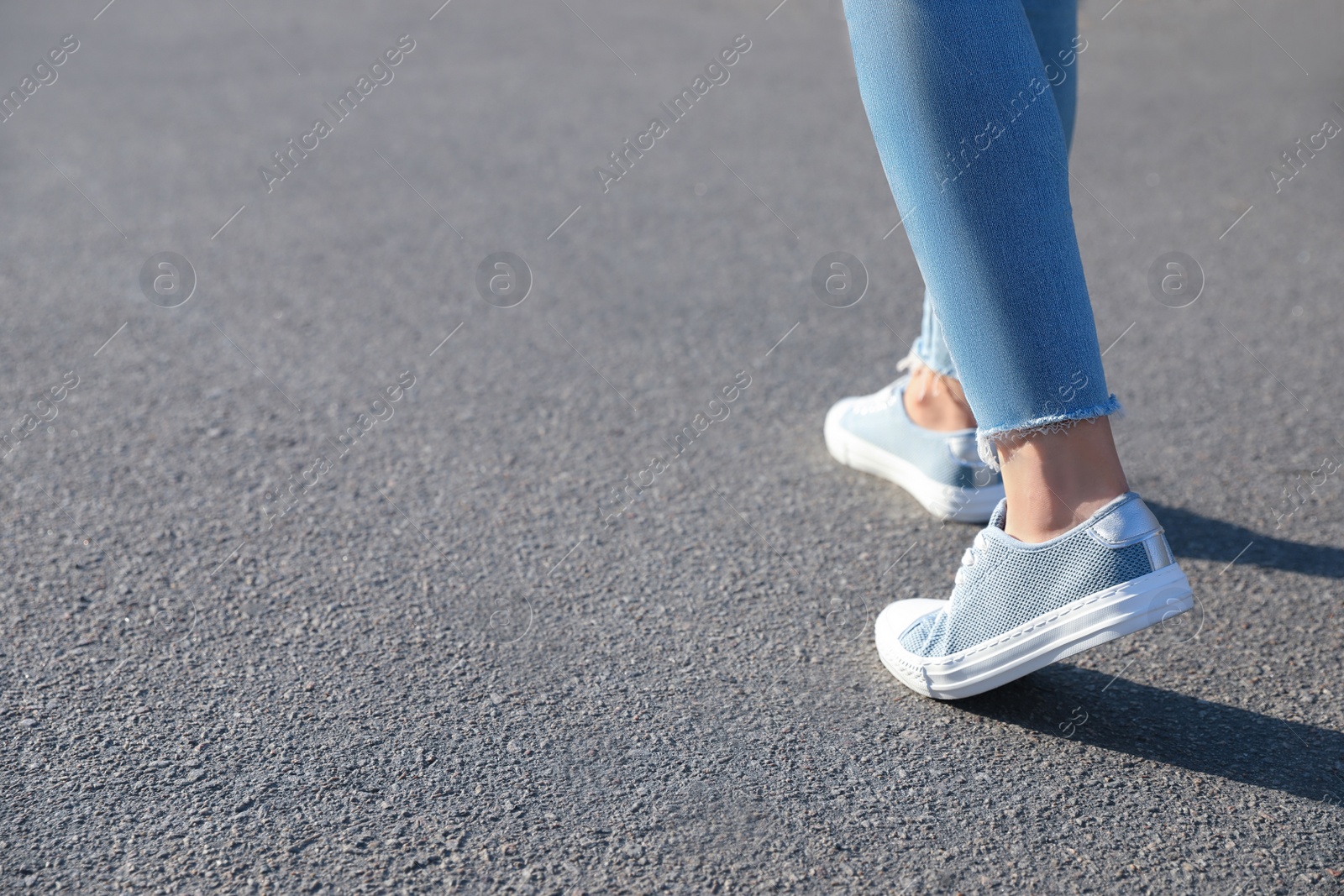 Photo of Woman walking outdoors, closeup with space for text. Choosing way concept.