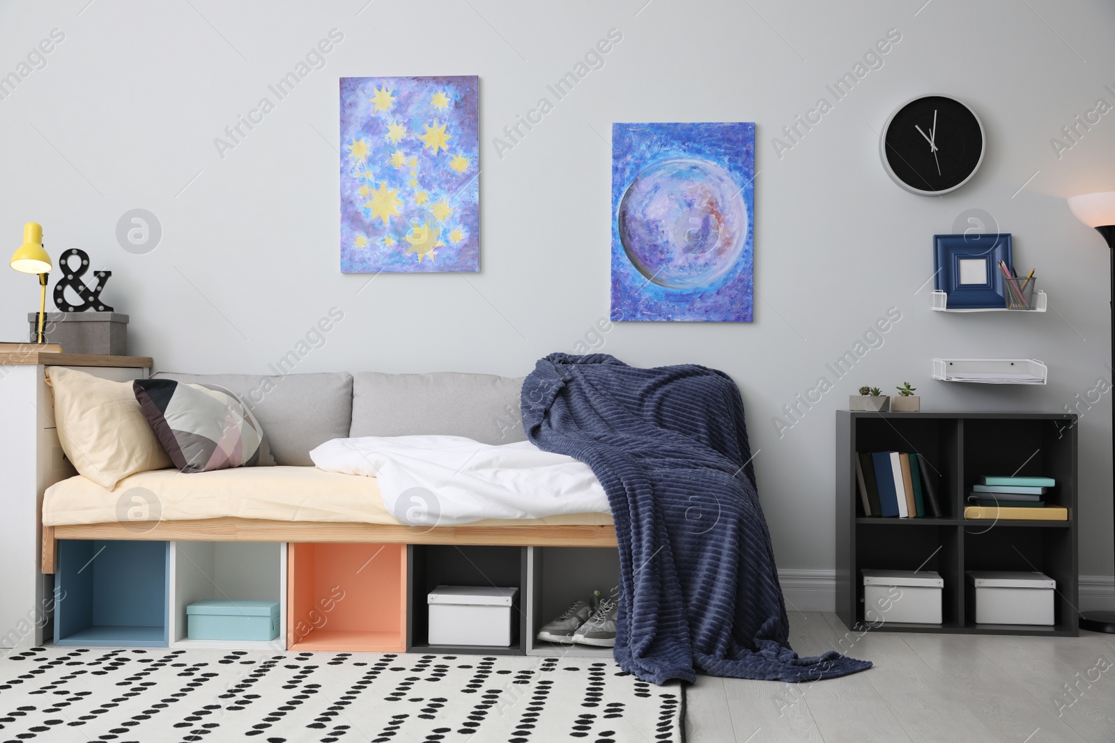 Photo of Modern teenager's room interior with comfortable bed and stylish design elements