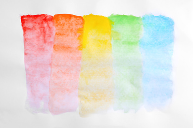 Paint brush strokes on white background, top view. Rainbow colors