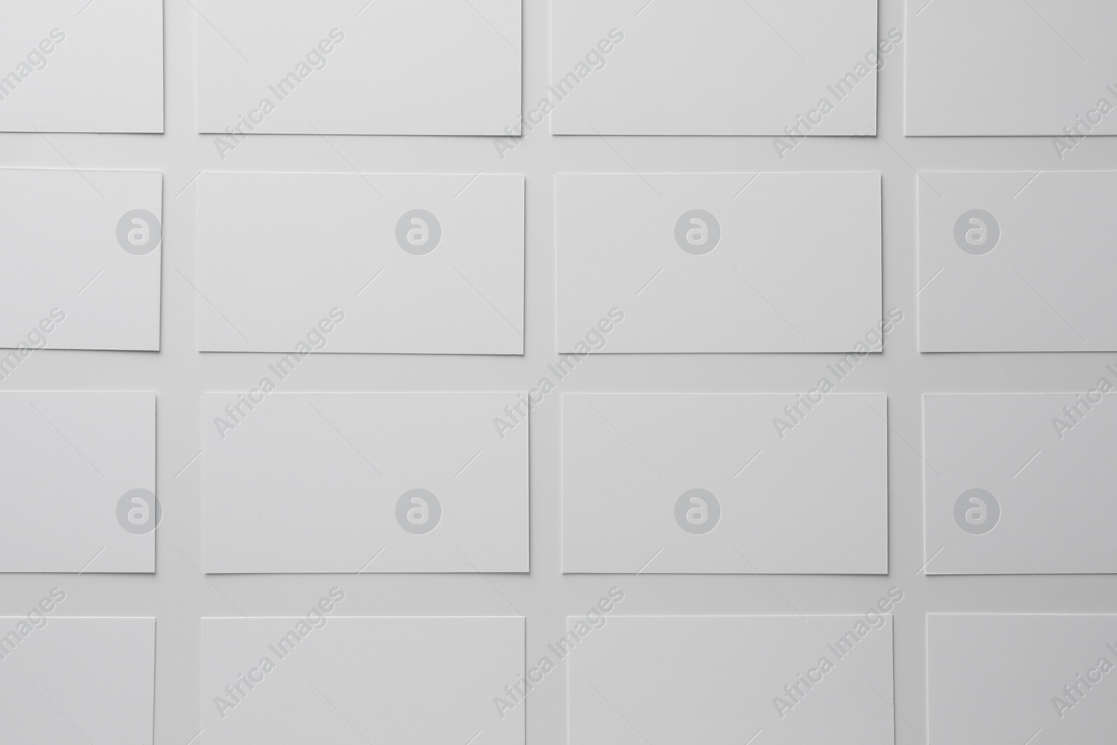 Photo of Blank business cards on white background, flat lay. Mockup for design