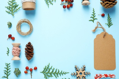 Flat lay composition with Christmas items and space for text on blue background