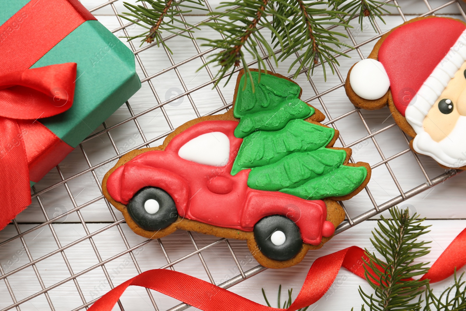 Photo of Tasty homemade Christmas cookies and decor on white wooden table, flat lay