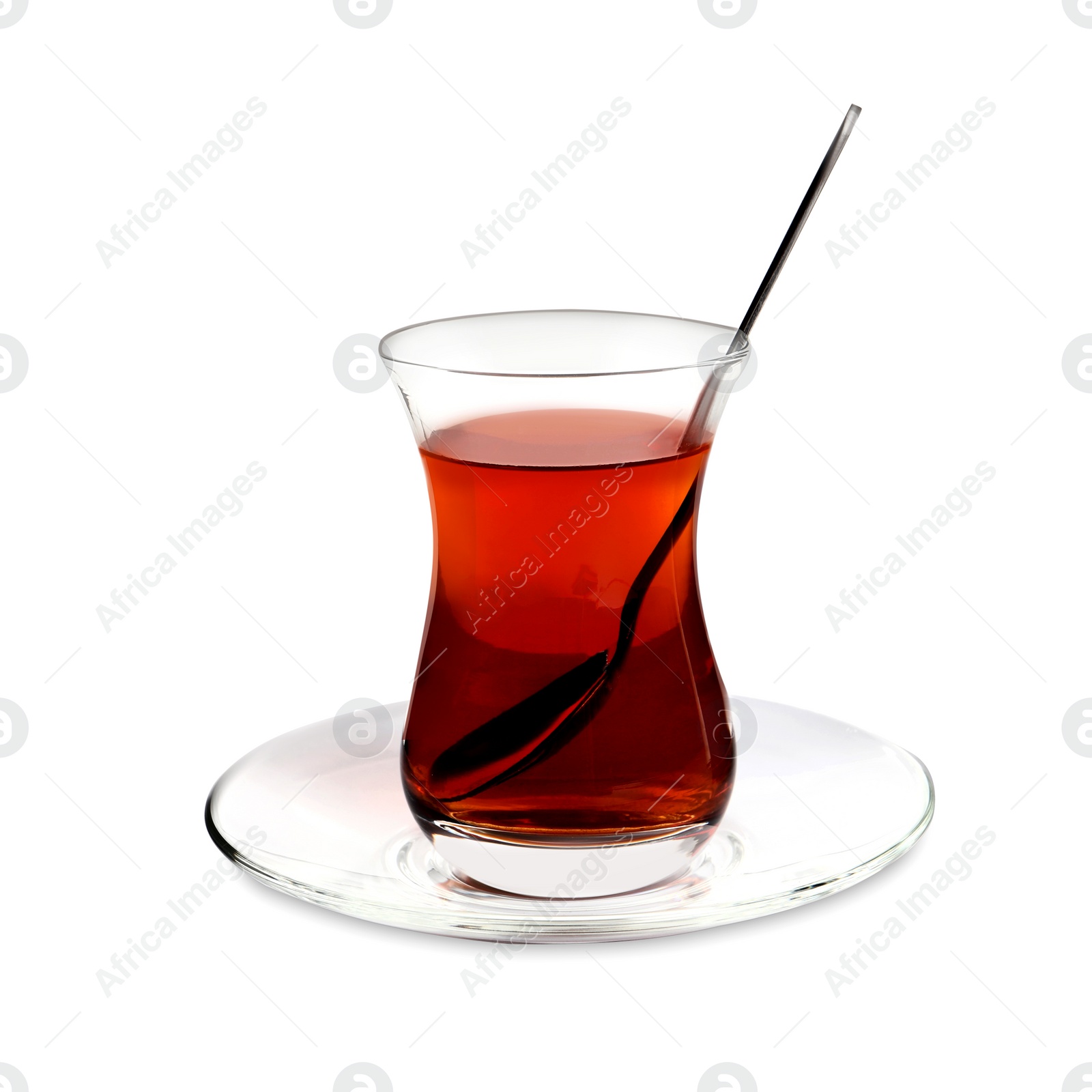 Photo of Glass of traditional Turkish tea with spoon isolated on white