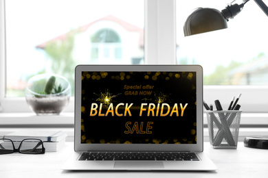 Black Friday announcement on laptop screen. Online shopping