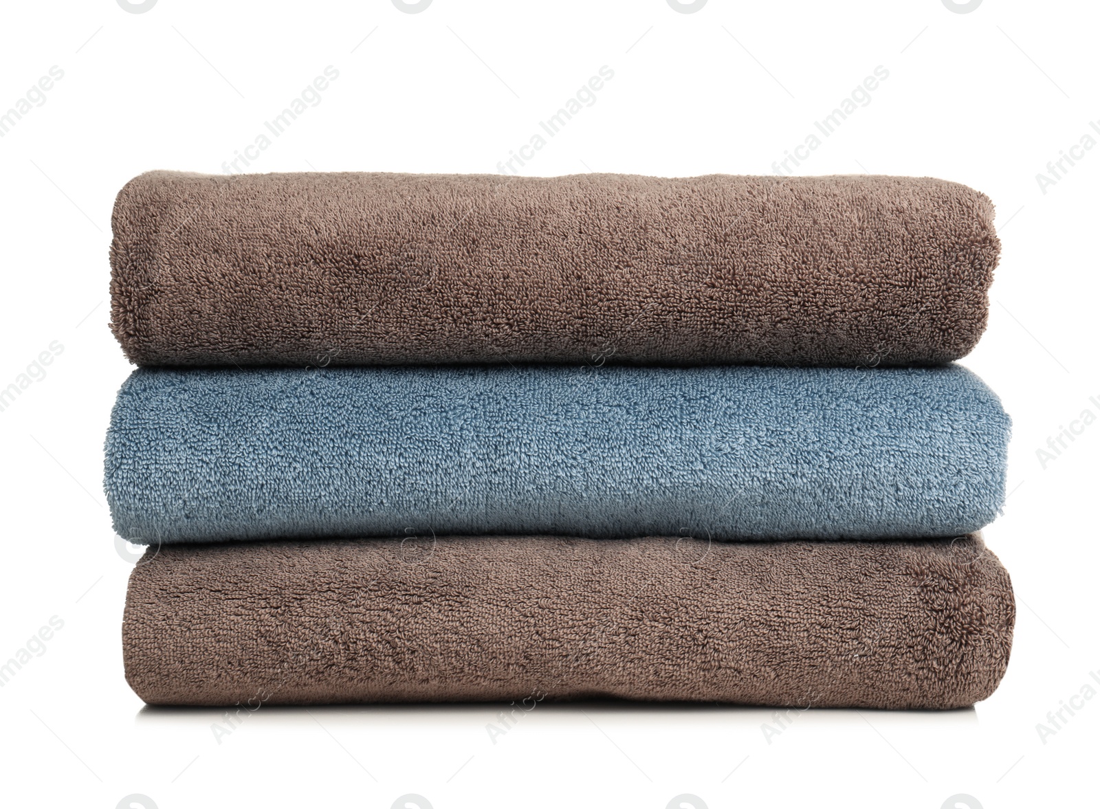 Photo of Folded soft terry towels on white background