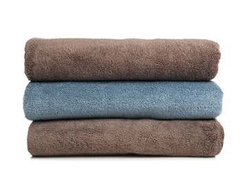 Photo of Folded soft terry towels on white background