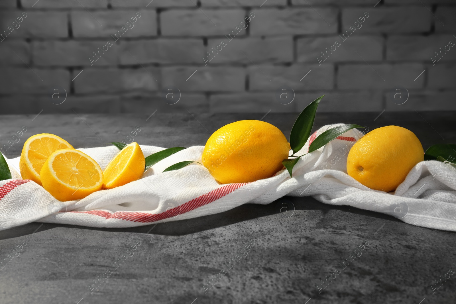 Photo of Fresh juicy lemons on table