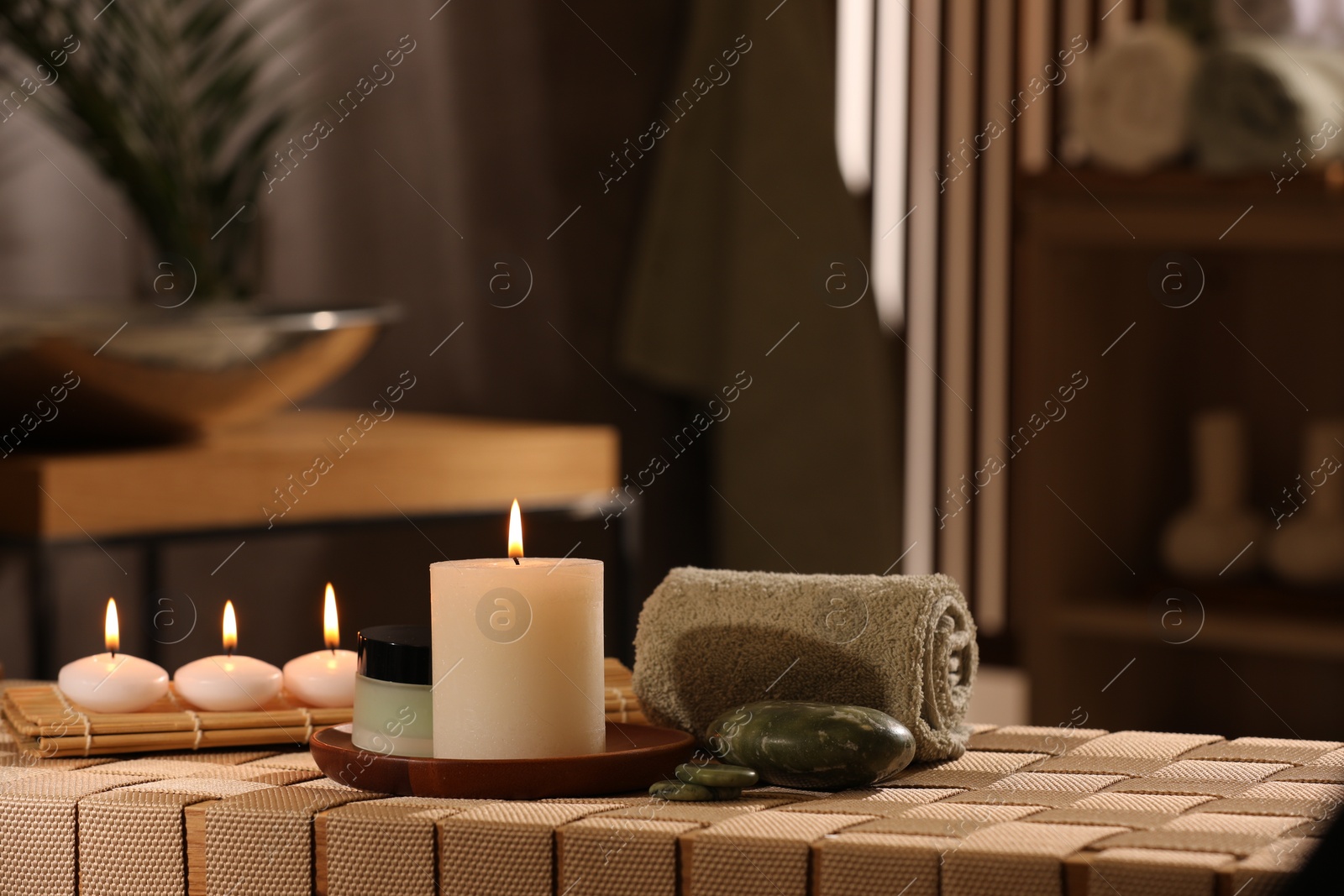 Photo of Beautiful composition with different spa products on wicker bench indoors