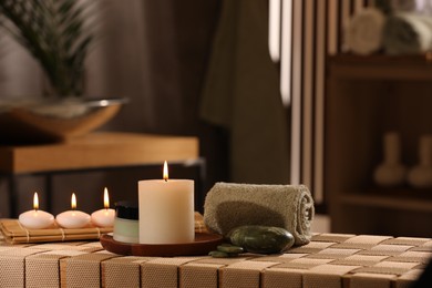 Photo of Beautiful composition with different spa products on wicker bench indoors