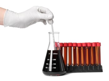 Photo of Scientist mixing brown liquid in conical flask on white background, closeup