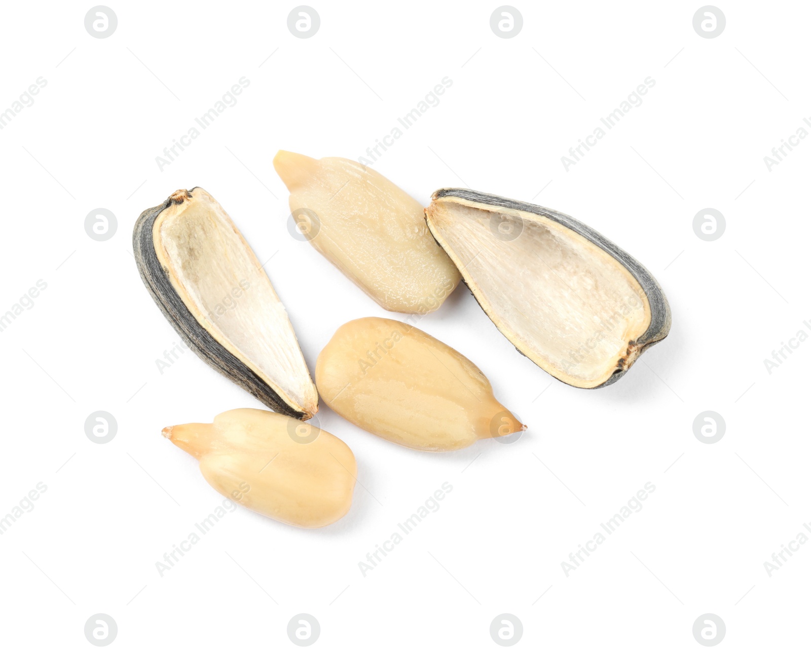 Photo of Raw peeled sunflower seeds and shell isolated on white