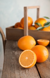 Fresh juicy oranges on wooden table. Healthy fruits