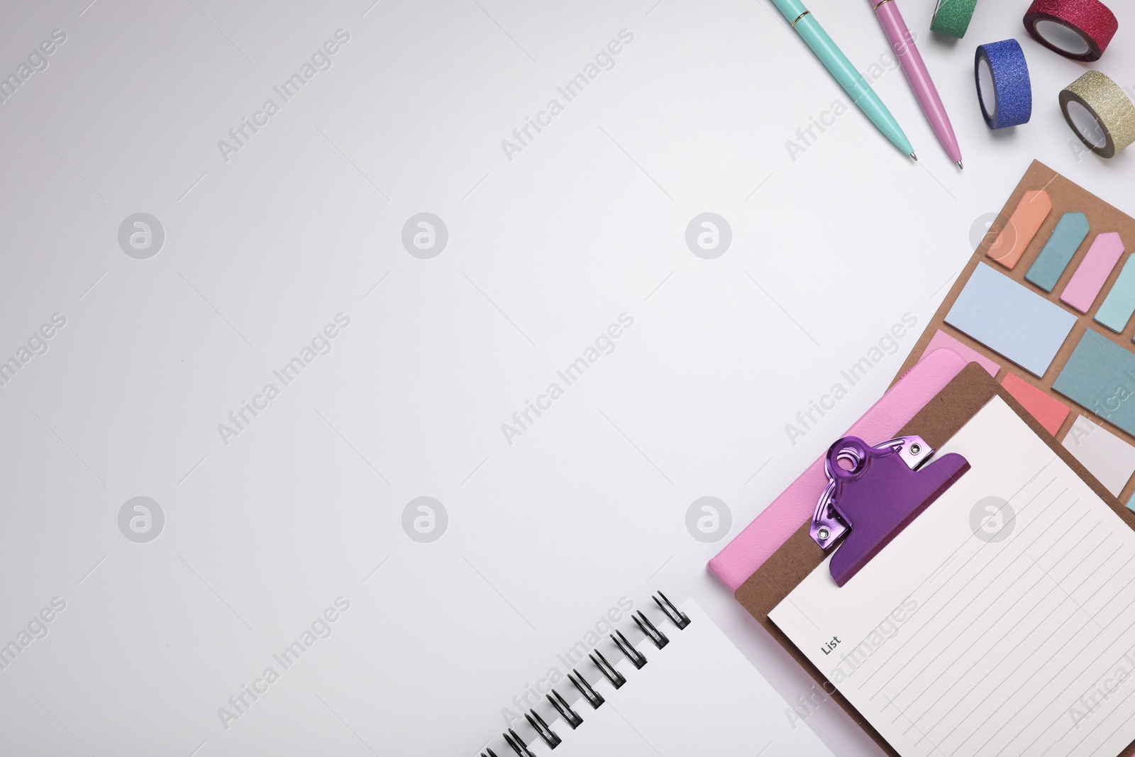 Photo of To do notes, planner and stationery on white background, flat lay. Space for text