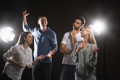 Photo of Professional actors rehearsing on stage in theatre