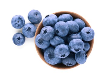 Photo of Bowl with tasty fresh ripe blueberries on white background, top view