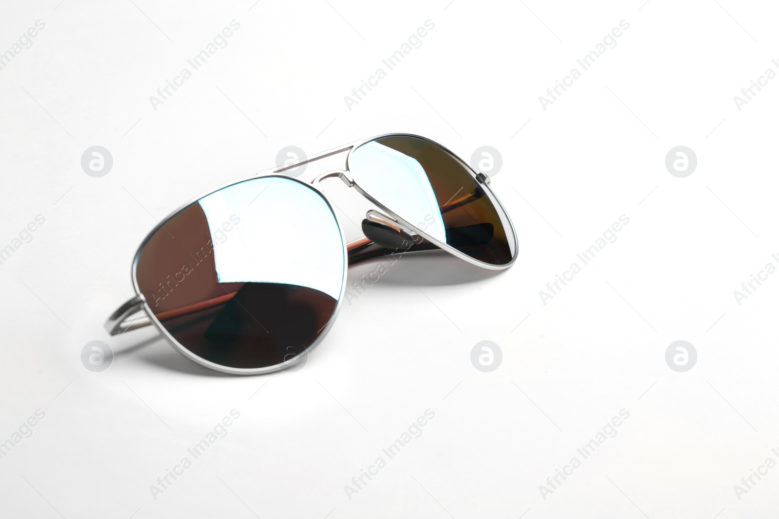 Photo of Stylish sunglasses on white background. Fashionable accessory