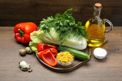 Photo of Chinese cabbage and different products on wooden table