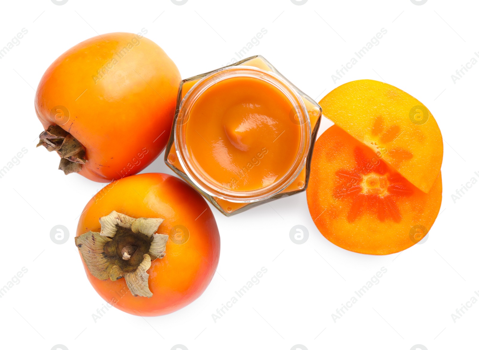 Photo of Delicious persimmon jam and fresh fruits isolated on white, top view