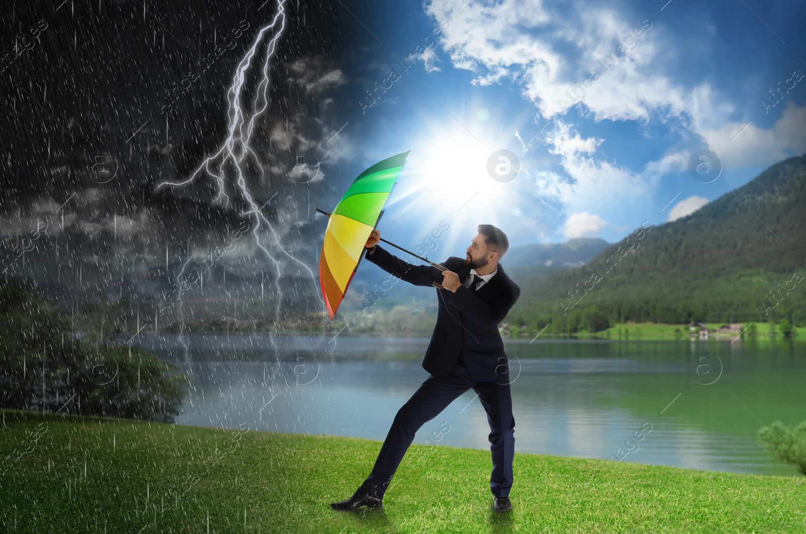 Image of Businessman with umbrella under heavy rain. Insurance concept