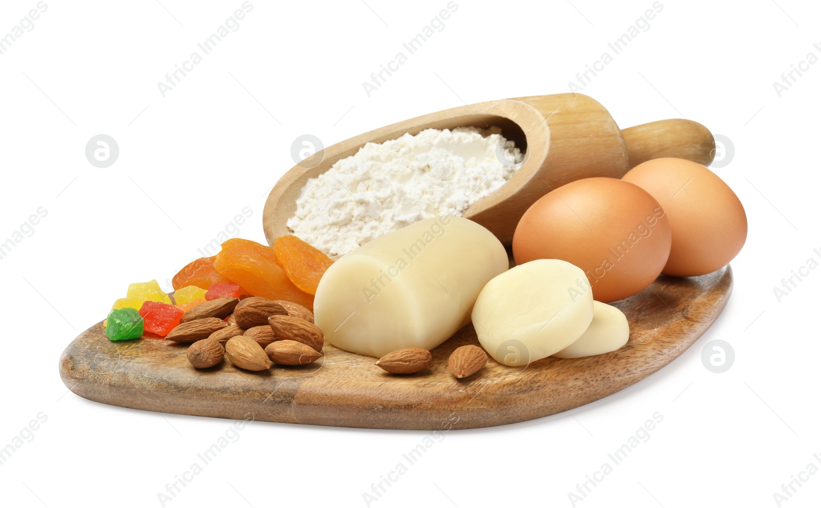 Photo of Marzipan and other ingredients for homemade Stollen on white background. Baking traditional German Christmas bread