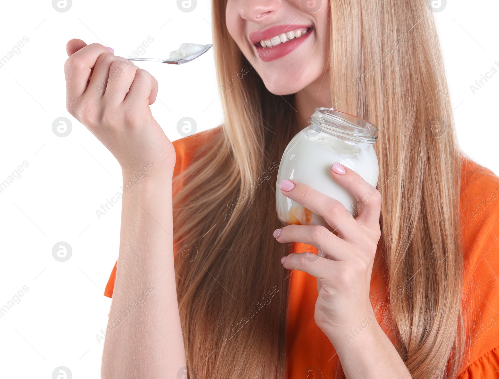 Photo of Young woman with yogurt on white background, closeup