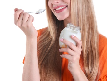 Young woman with yogurt on white background, closeup