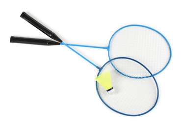 Photo of Rackets and shuttlecock on white background, top view. Badminton equipment