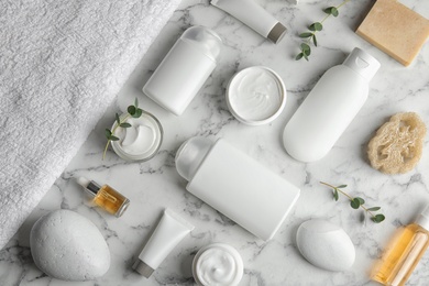 Photo of Flat lay composition with different body care products on marble background. Mockup for design