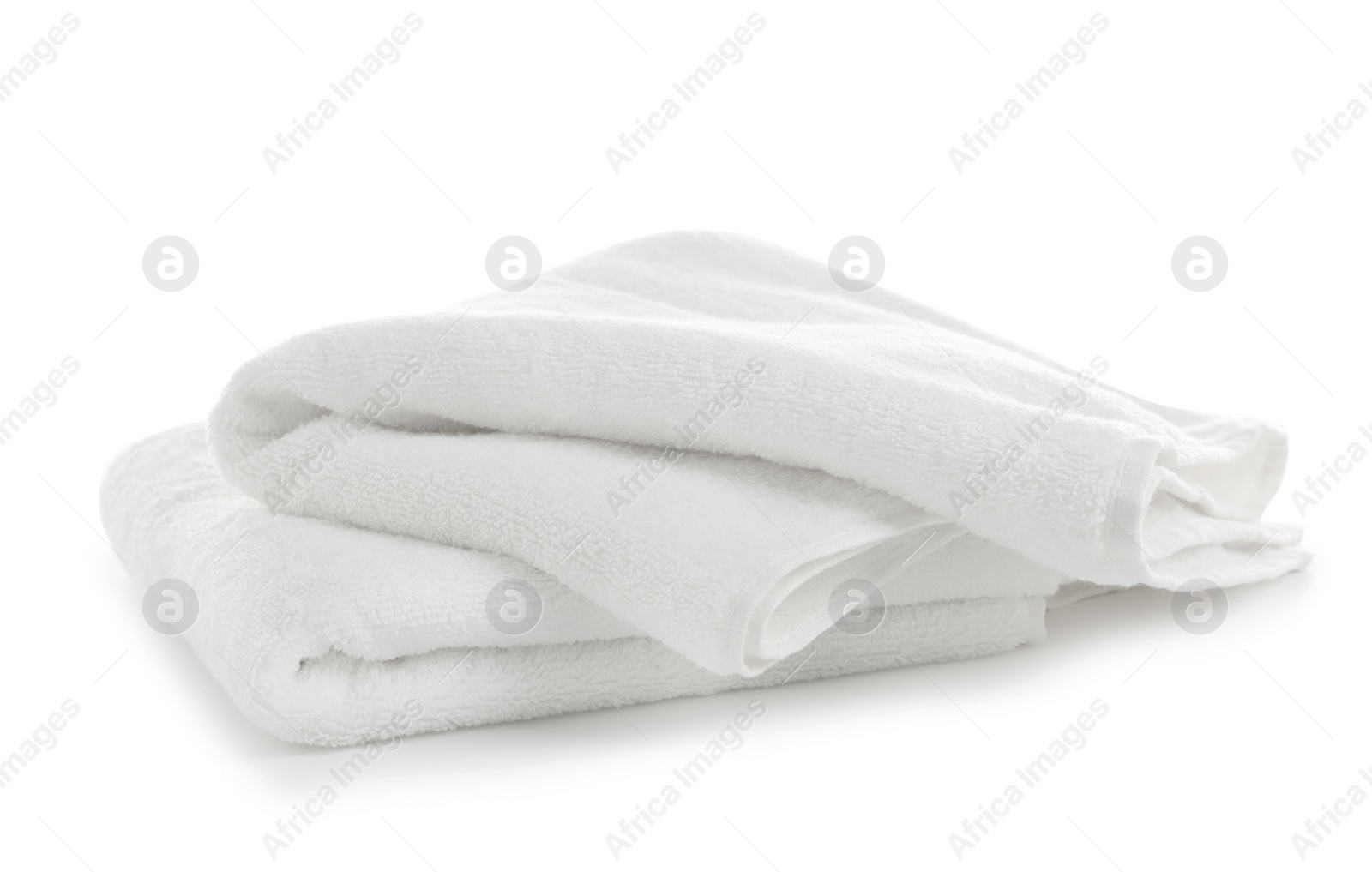 Photo of Folded clean soft towels on white background