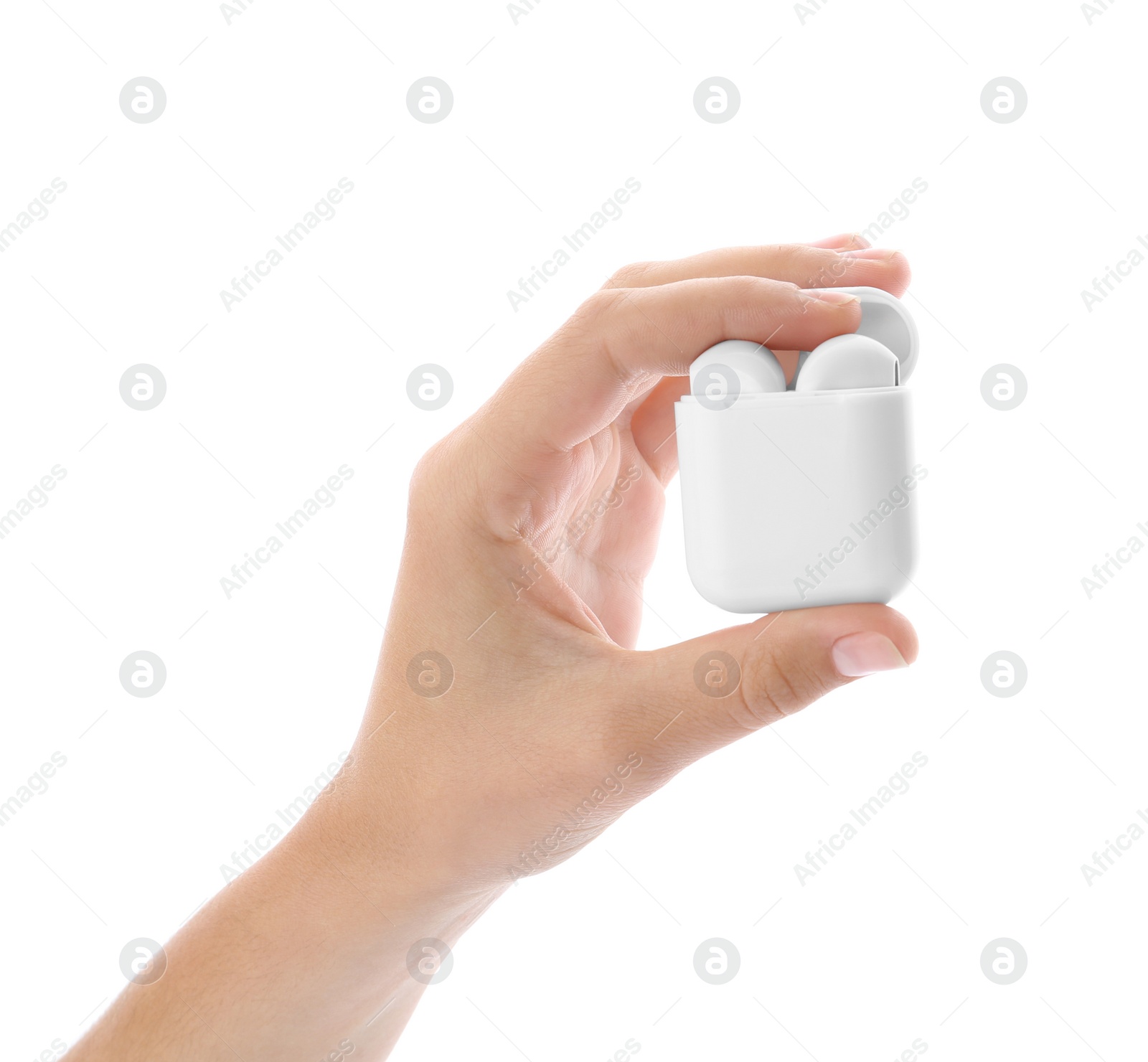 Photo of Woman holding modern wireless earphones in charging case on white background, closeup