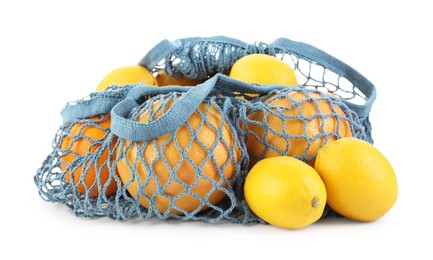 Photo of String bag with oranges and lemons isolated on white