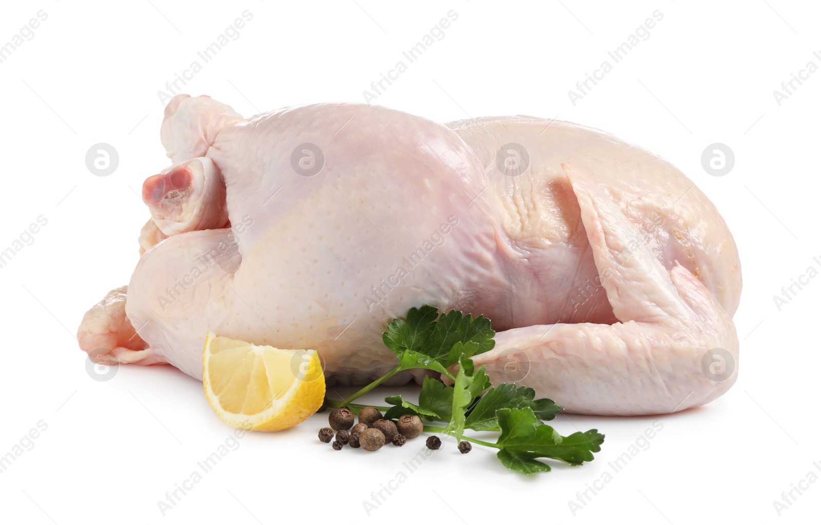 Photo of Fresh raw chicken with lemon and spices isolated on white