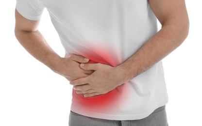 Image of Man suffering from pain in lower right abdomen on white background, closeup. Acute appendicitis