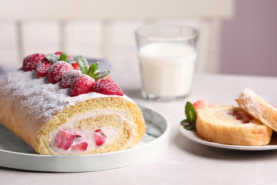 Photo of Delicious cake roll with strawberries and cream on light gray table