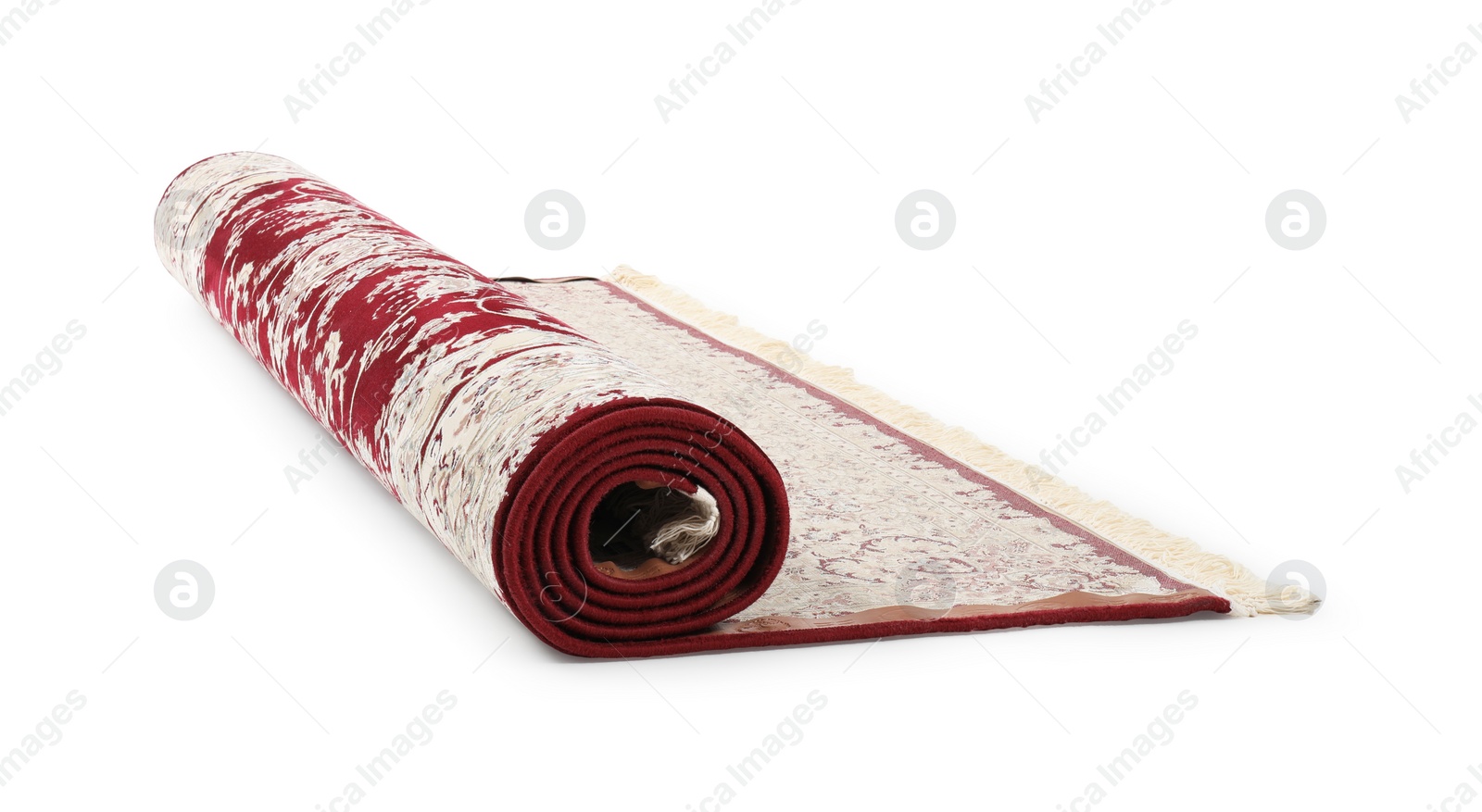 Photo of Rolled carpet with pattern on white background. Interior element