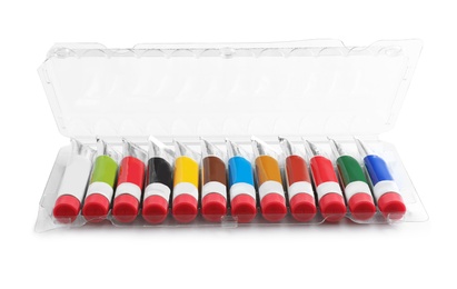 Photo of Box with colorful paints on white background. Artistic equipment for children