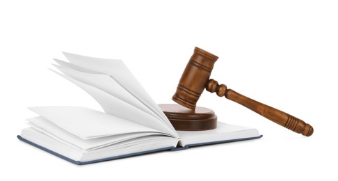 Photo of Wooden gavel and open book on white background