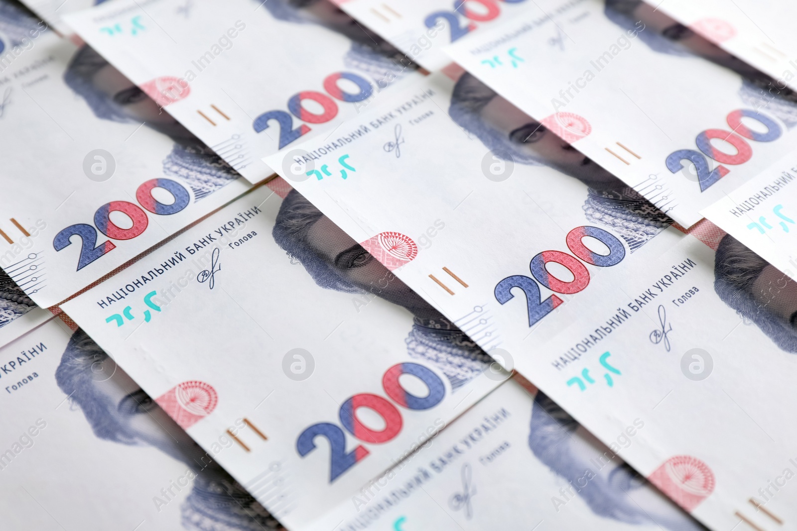 Photo of Closeup view of Ukrainian money as background. National currency