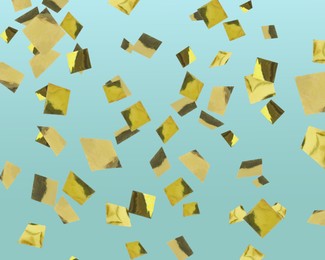 Shiny golden confetti falling on light blue background