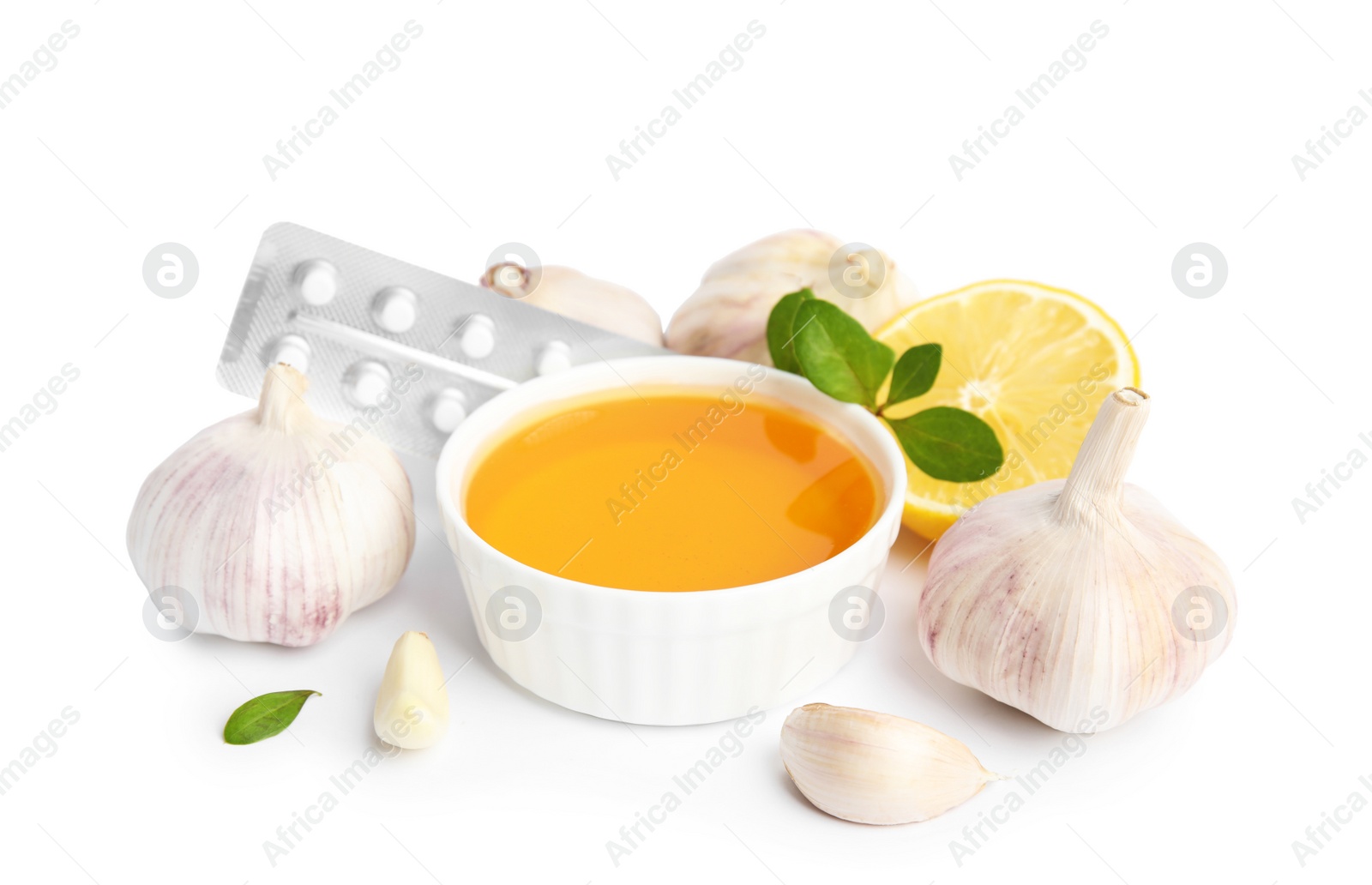 Photo of Composition with garlic and other cold remedies on white background