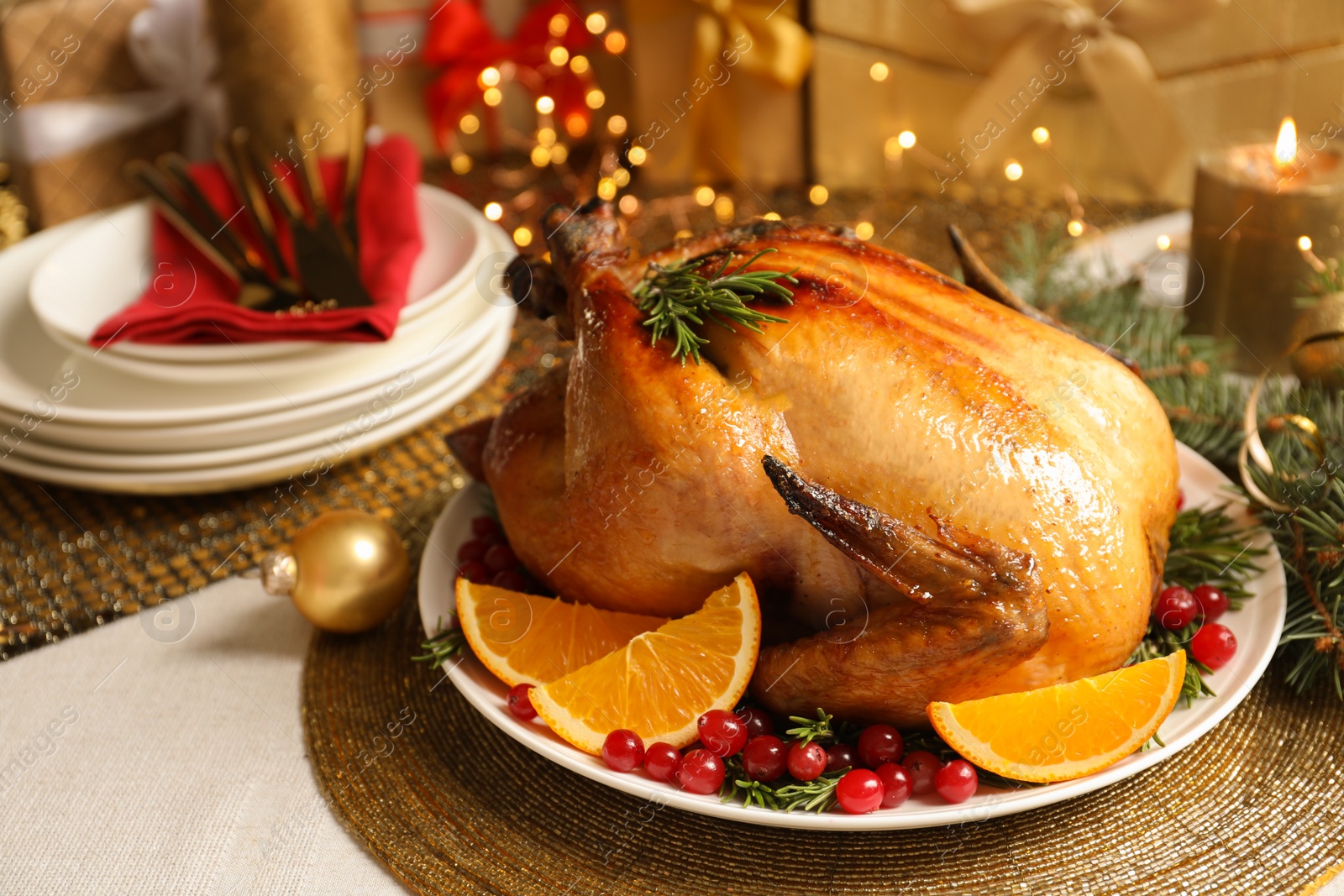 Photo of Delicious roasted turkey served for Christmas dinner on table