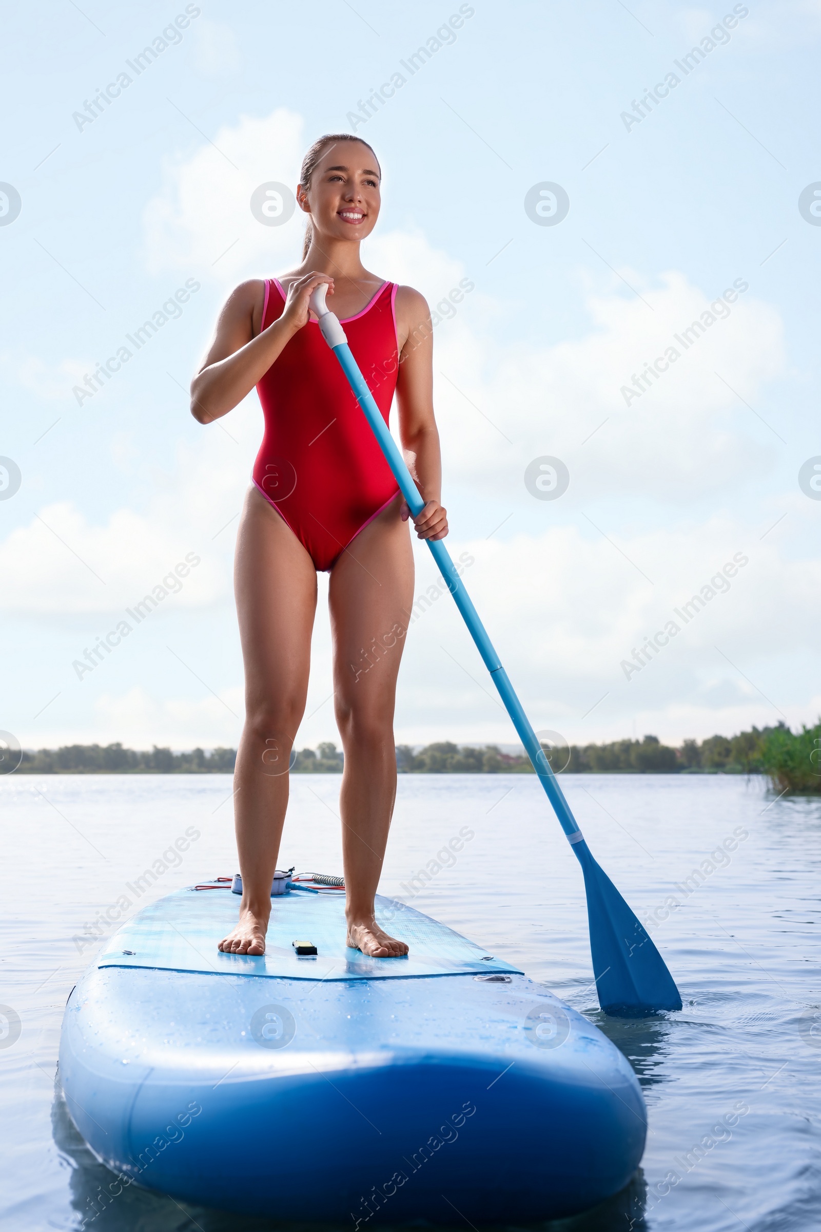 Photo of Woman paddle boarding on SUP board in sea