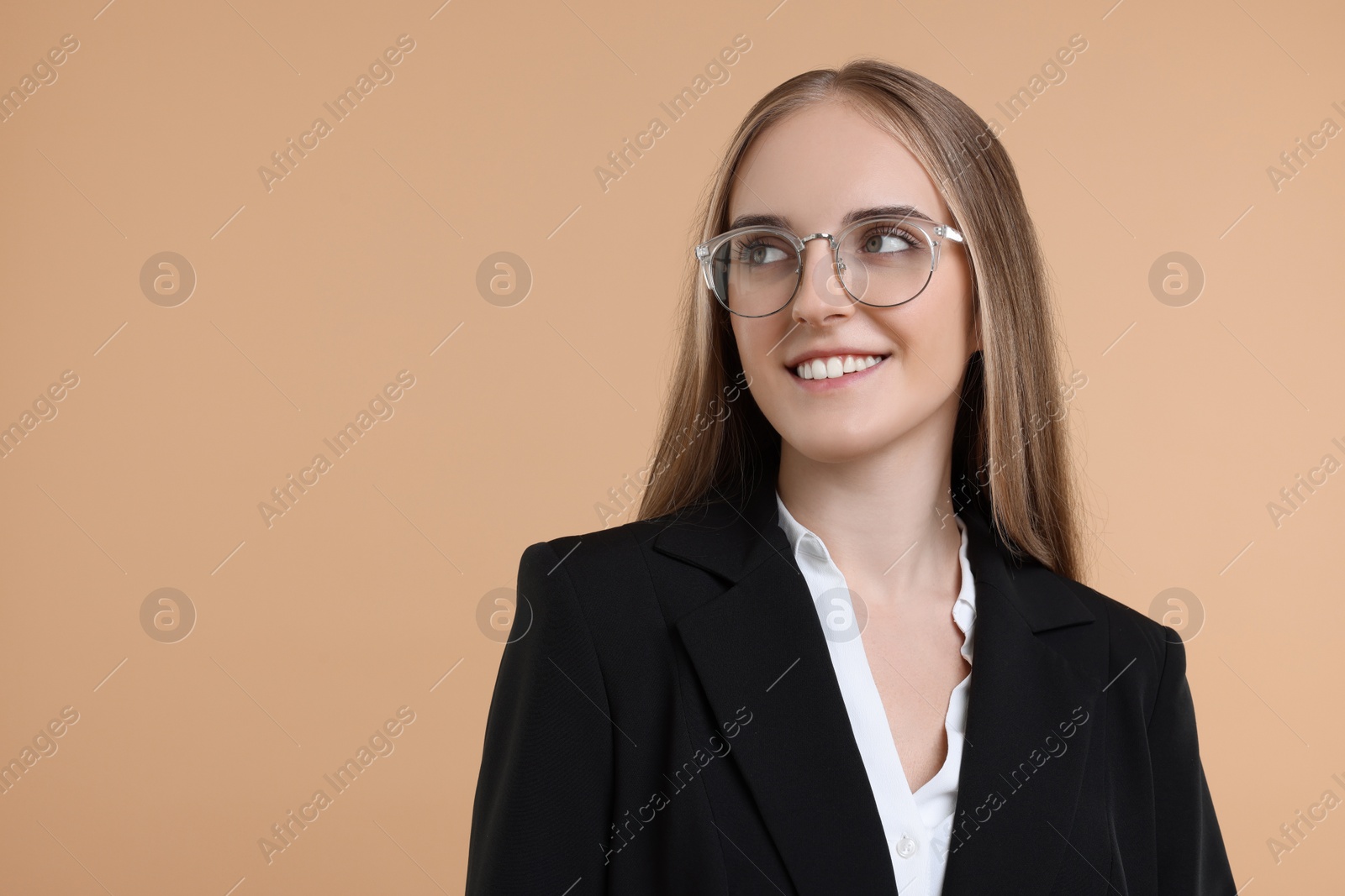 Photo of Portrait of happy young secretary on beige background, space for text