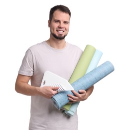 Man with wallpaper rolls and spatula on white background