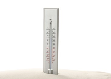 Photo of Weather thermometer in sand against white background