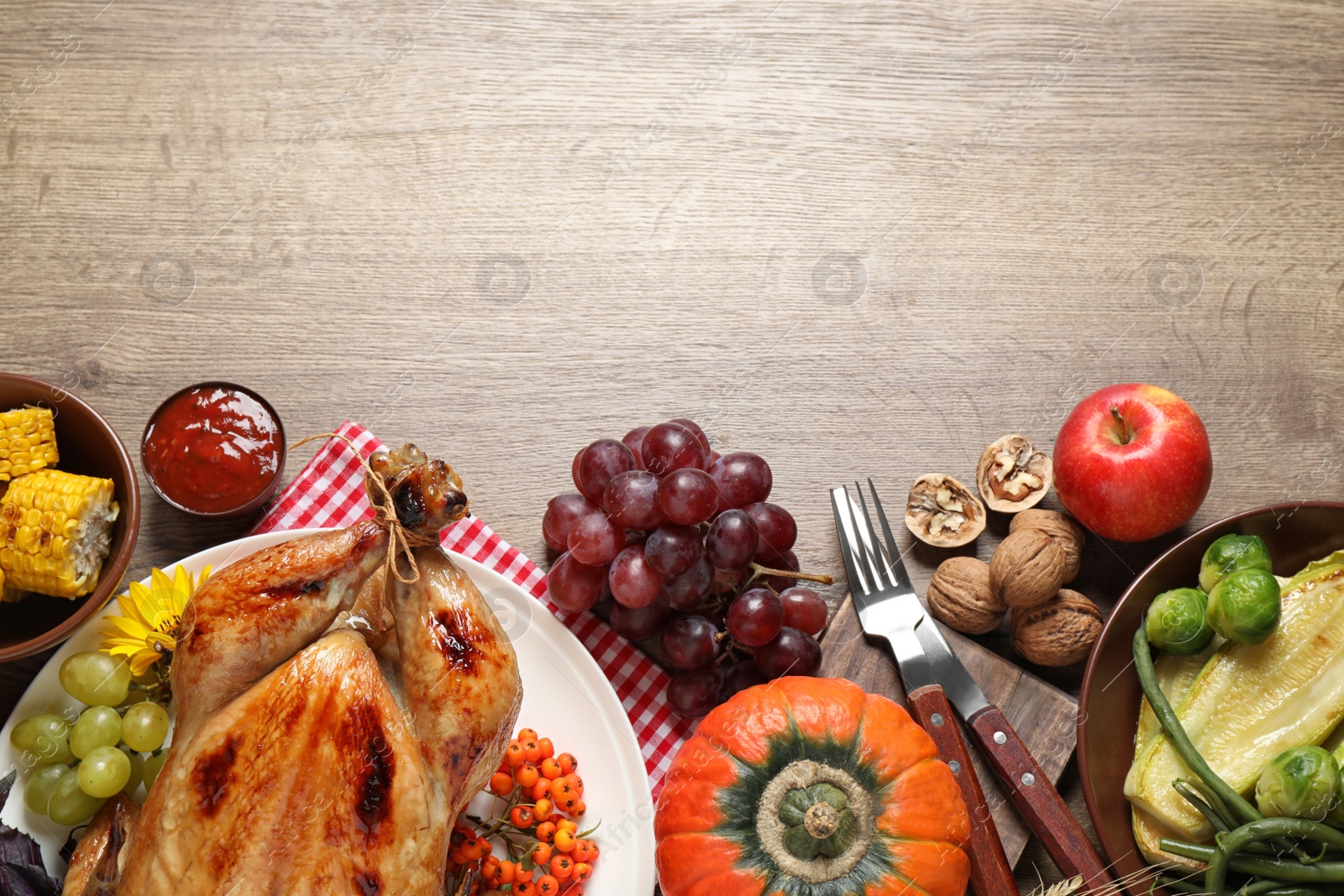 Photo of Flat lay composition with turkey on wooden background, space for text. Happy Thanksgiving day