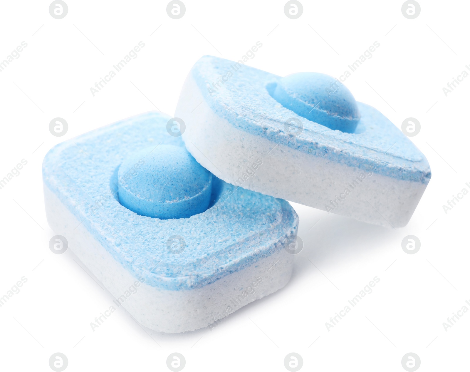 Photo of Two water softener tablets isolated on white